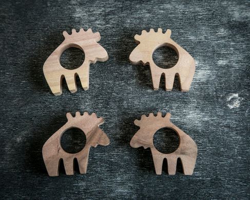 A set of wooden napkin rings Norwegian Moose