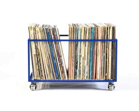 Record holder on rotating wheels holds over 100 LP records by Atelier Article, Blue