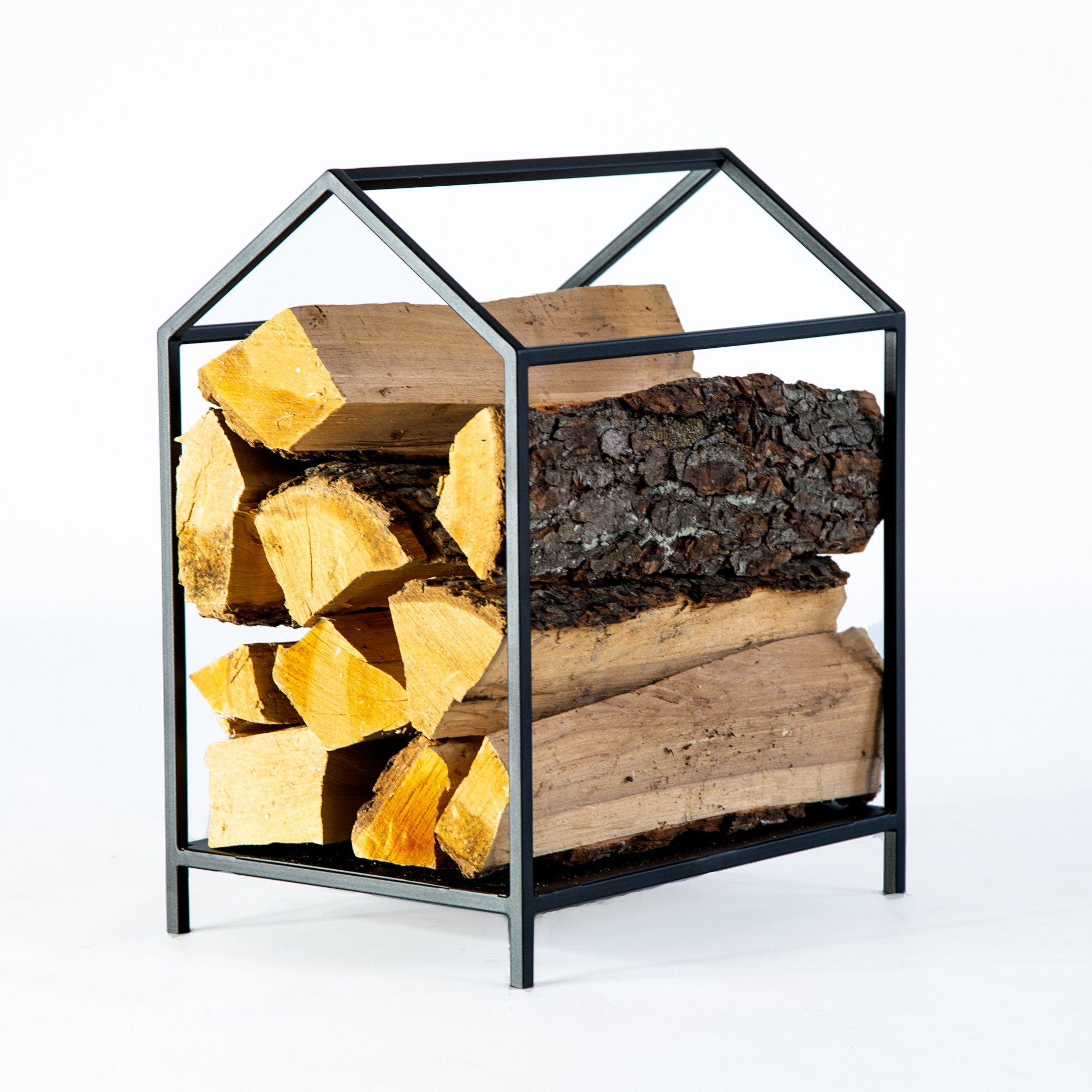 Black metal log holder with a small footprint - Atelier Article