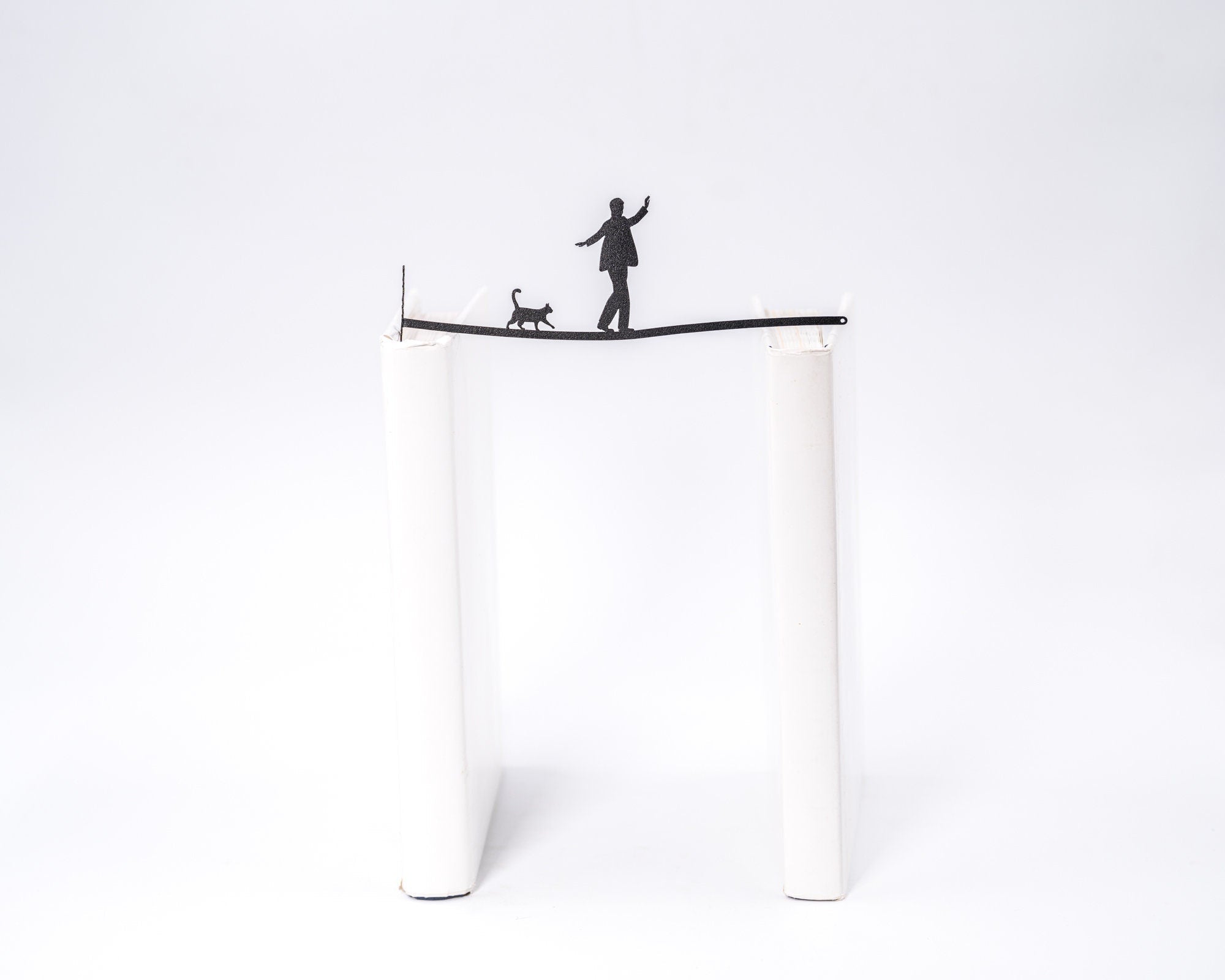 "Balancing Act." Bookmark - Atelier Article