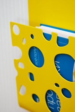 Wall Rack // shelf for magazines or books // Swiss Cheese // by Atelier Article, Yellow